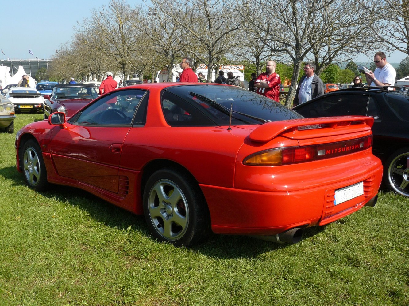 1990s sports coupe with rear spoiler and distinct taillights