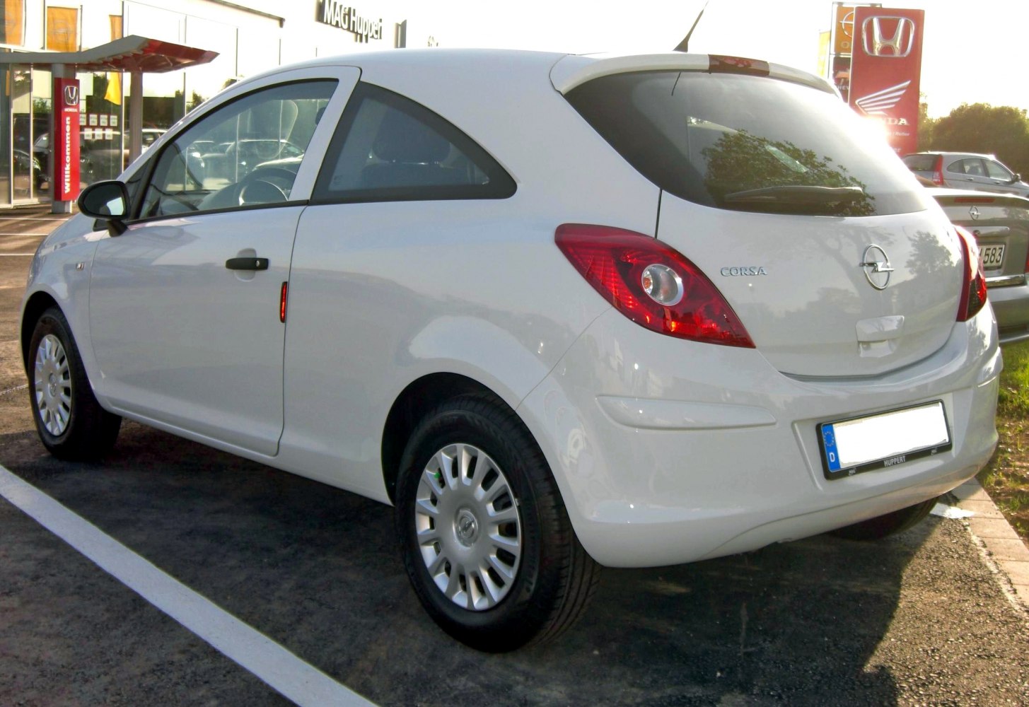 Rear and side view of a 3-door hatchback with distinct tail lights and compact design