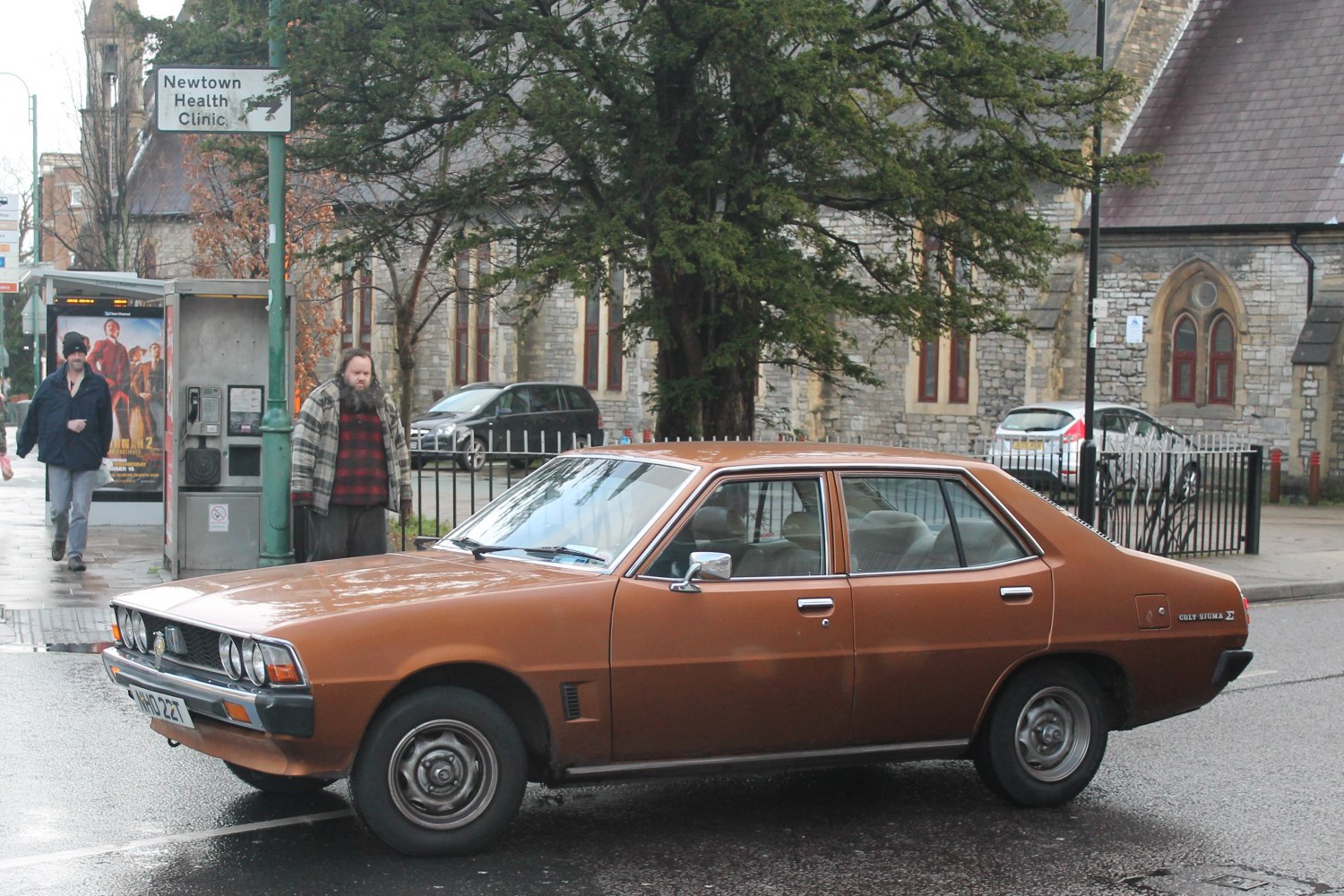 Four-door sedan with quad headlights and steel wheels.