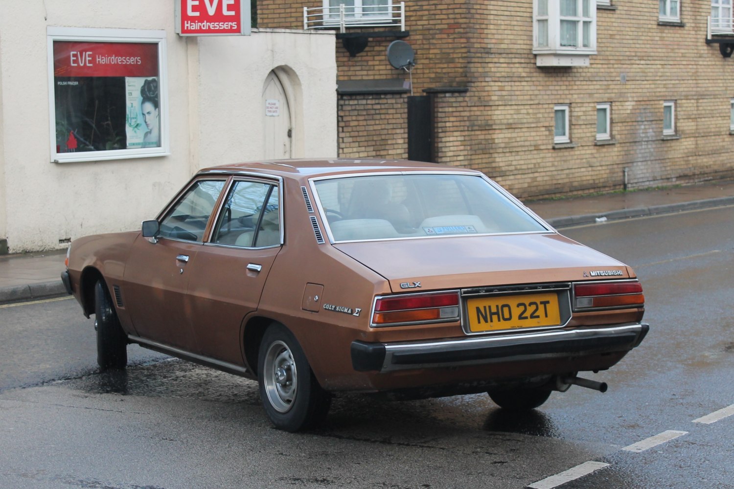 1970s sedan rear with rectangular taillights and chrome bumper