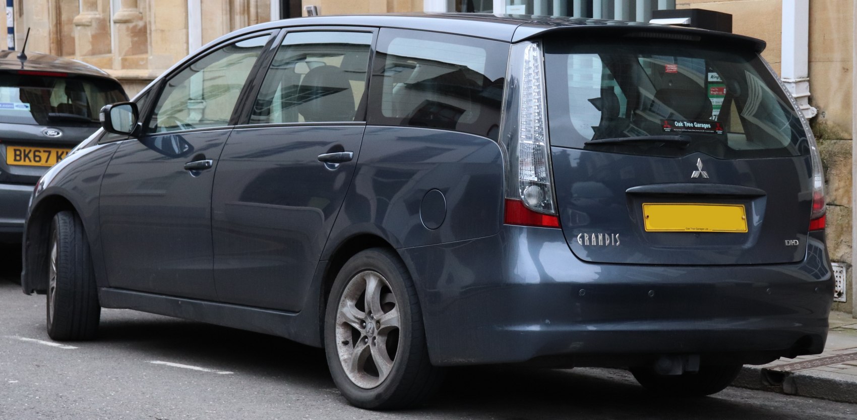 Rear and side view of MPV with tall vertical tail lights and window design