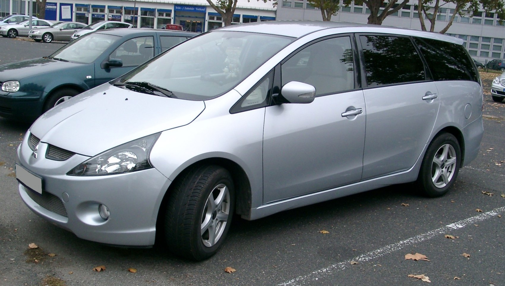 Silver MPV with sleek headlights and alloy wheels