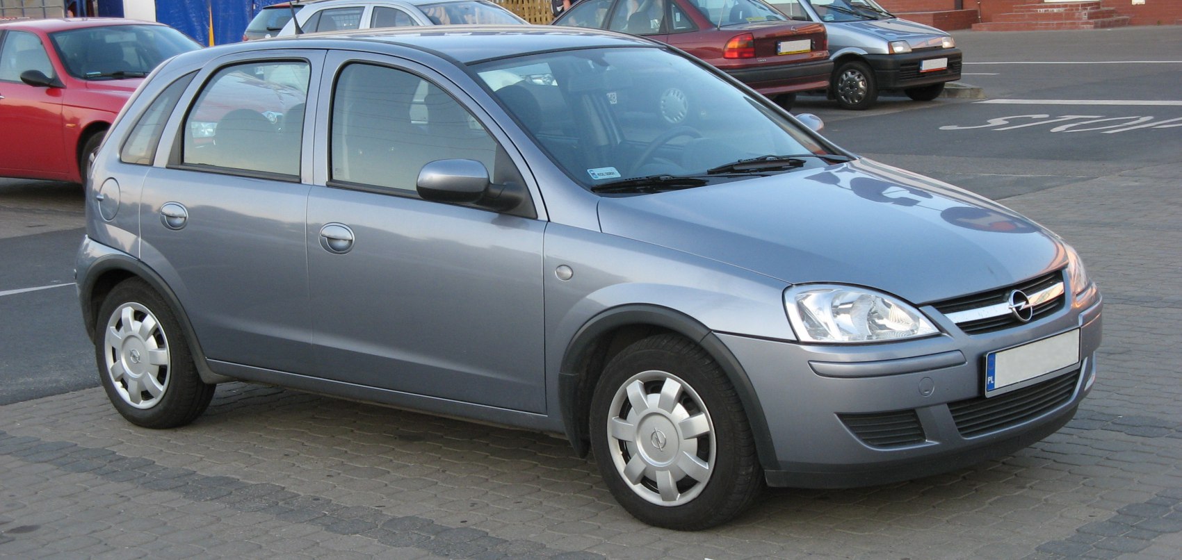 Front and side profile of compact facelift hatchback