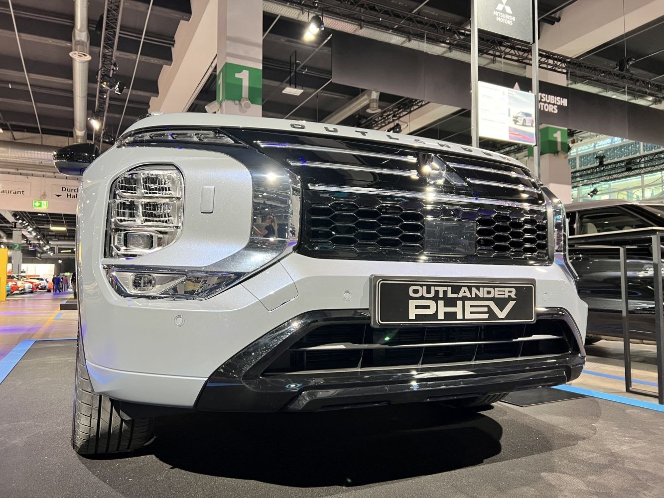 Close-up of front grille and multi-segment headlights on modern SUV