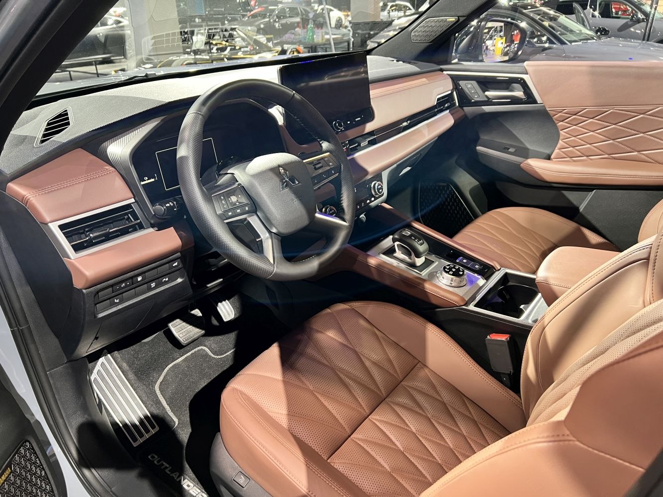 Luxury brown leather seats with modern digital dashboard and advanced controls