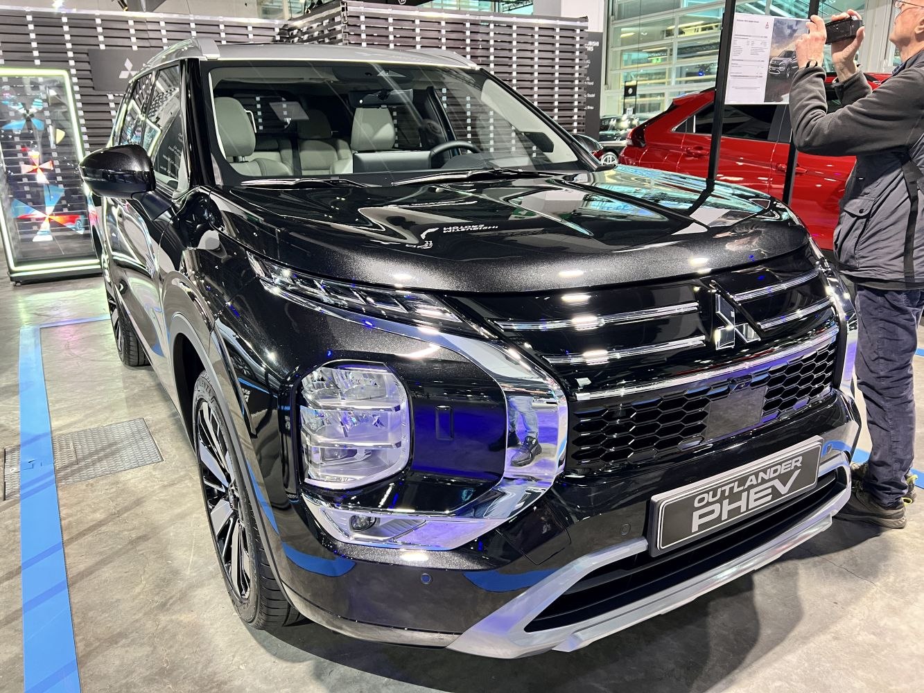 Front view of Mitsubishi SUV with LED headlights and prominent grille