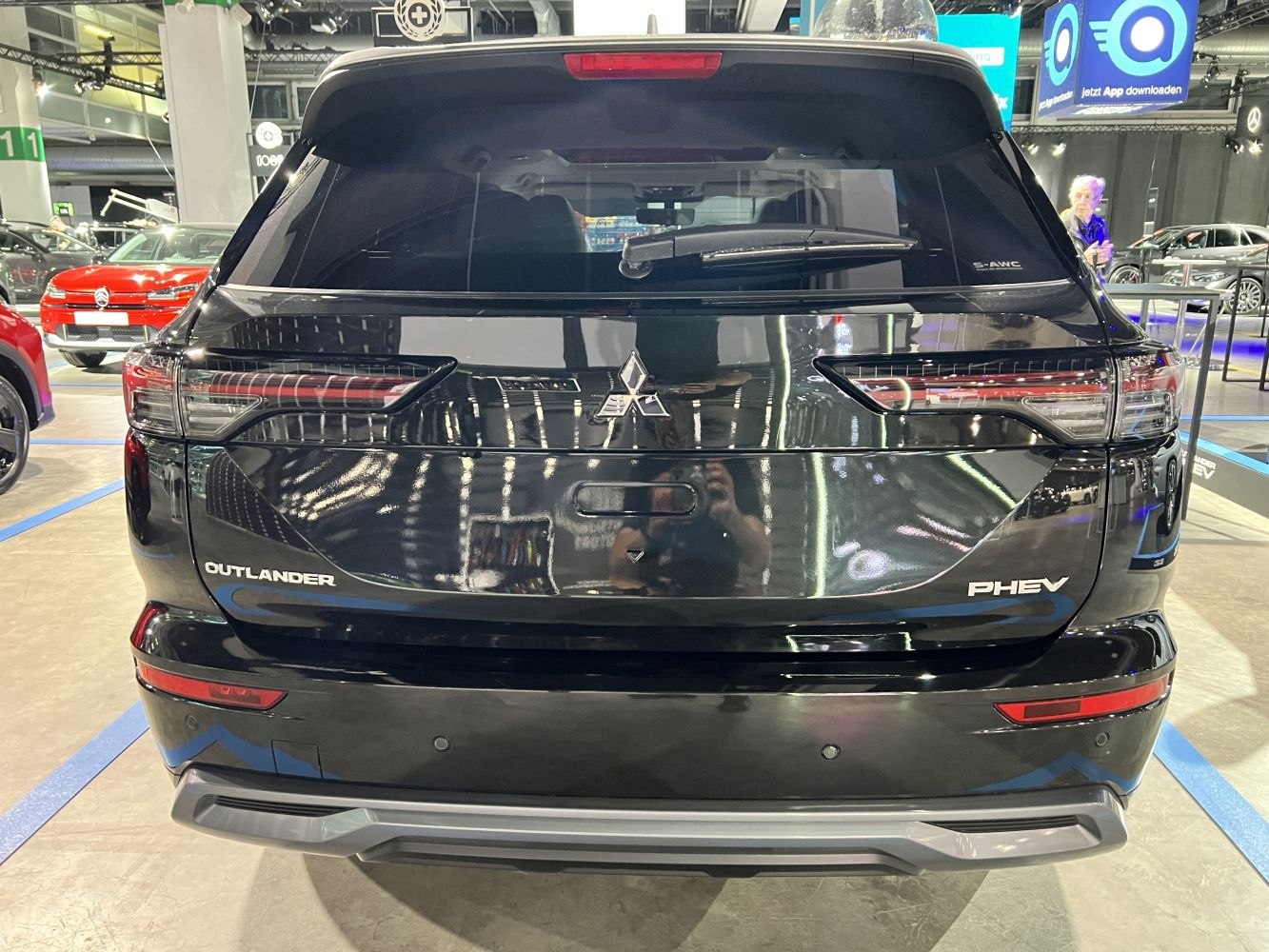 Rear view of a black hybrid SUV with modern taillights and rear windshield wiper