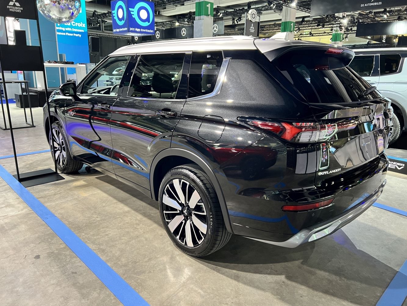 Rear and side profile of a black modern SUV with sleek taillights and alloy wheels