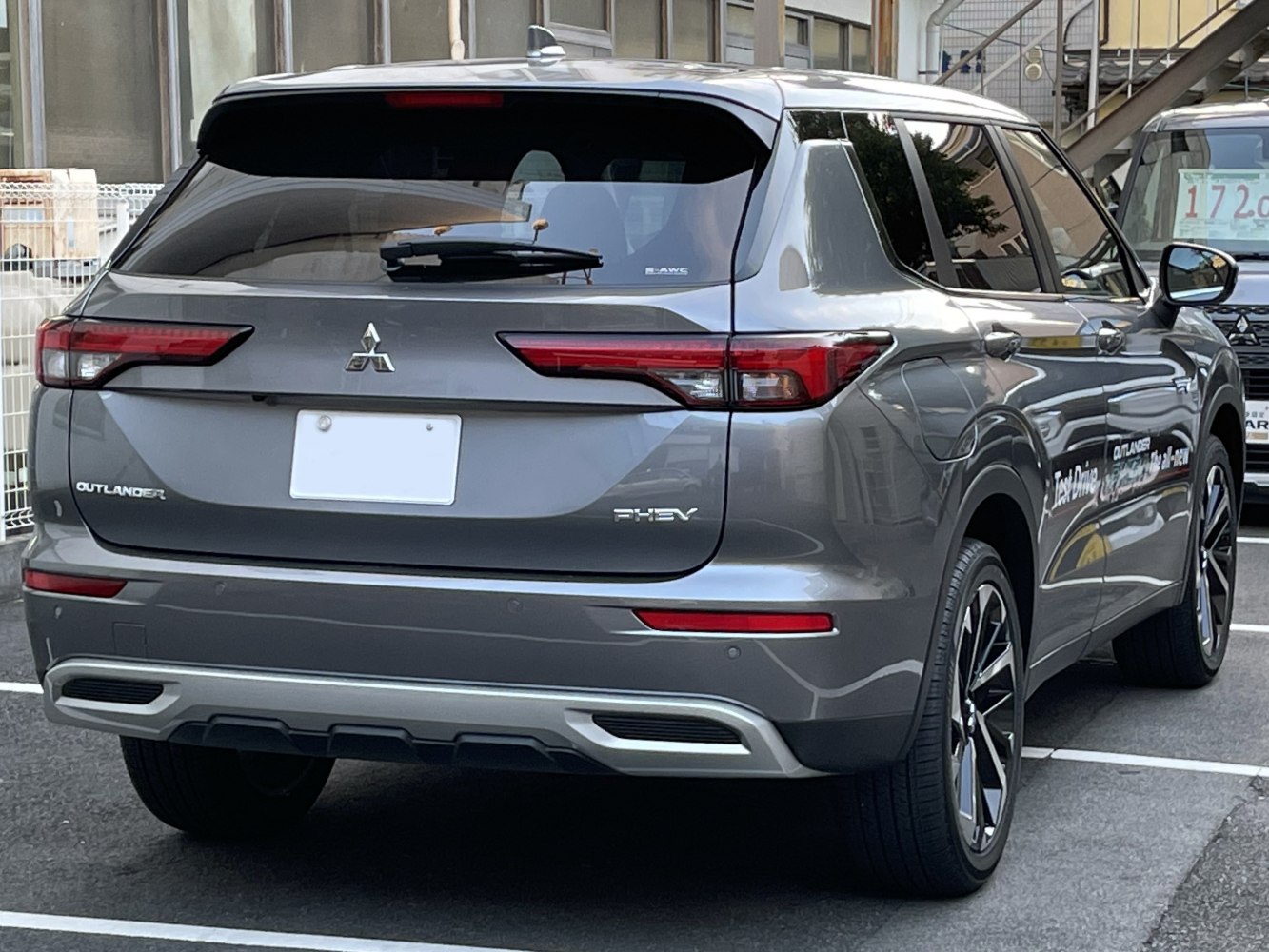 Rear view of SUV with modern tail lights and PHEV badge