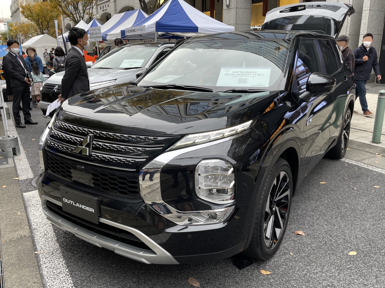 Close-up front view with distinctive grille and LED headlights