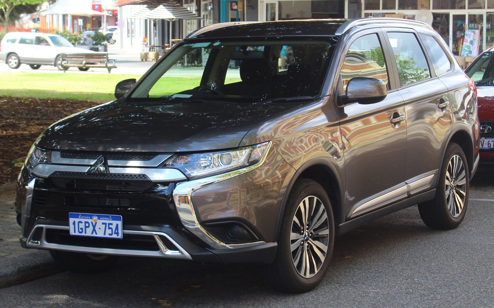 Front-side view of an SUV with sleek grille and alloy wheels