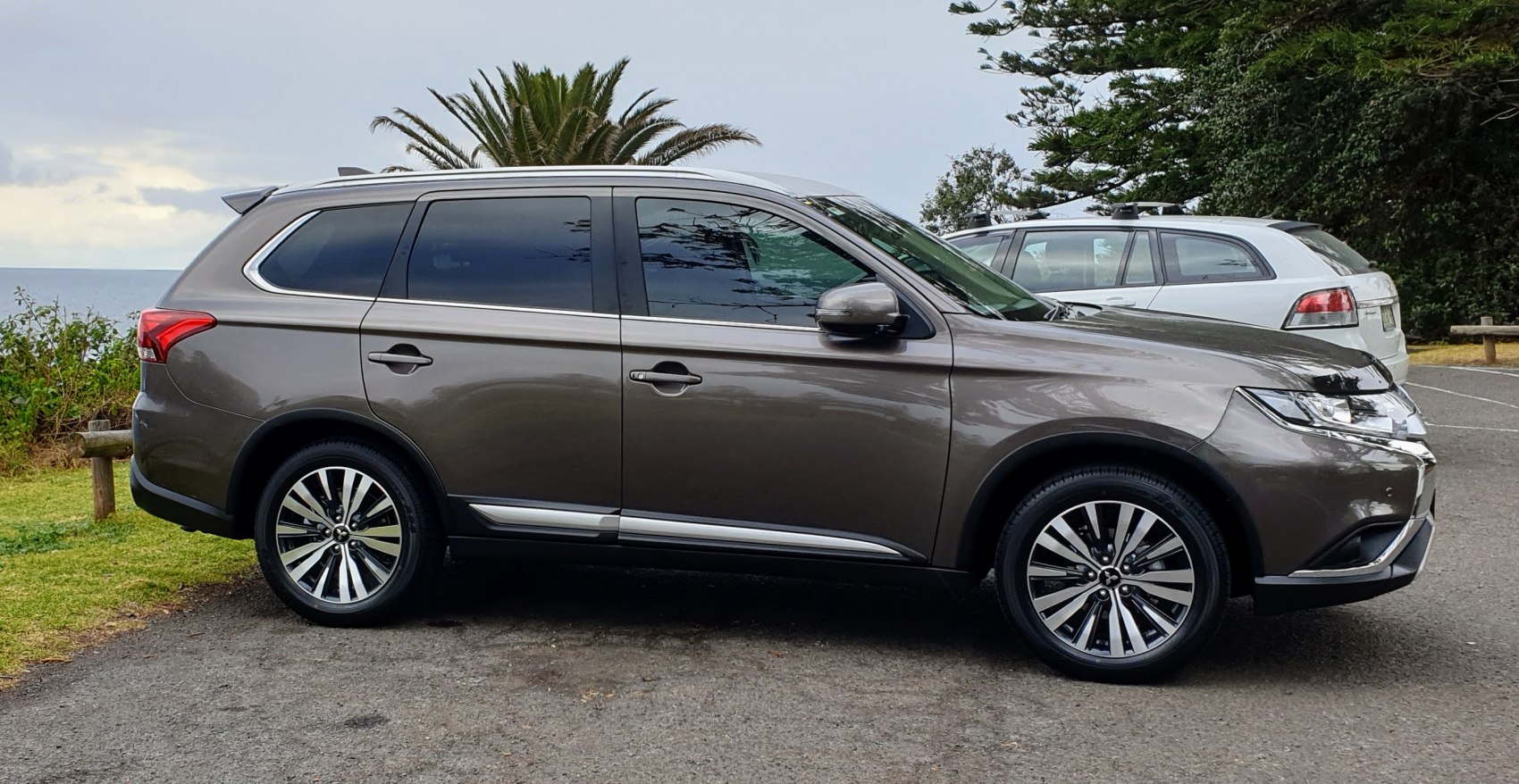 Side profile of an SUV with alloy wheels and tinted windows