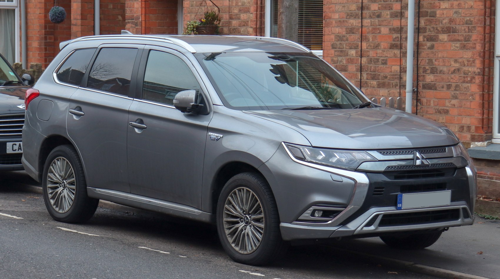 Side-front view of modern SUV with detailed headlight and grille design