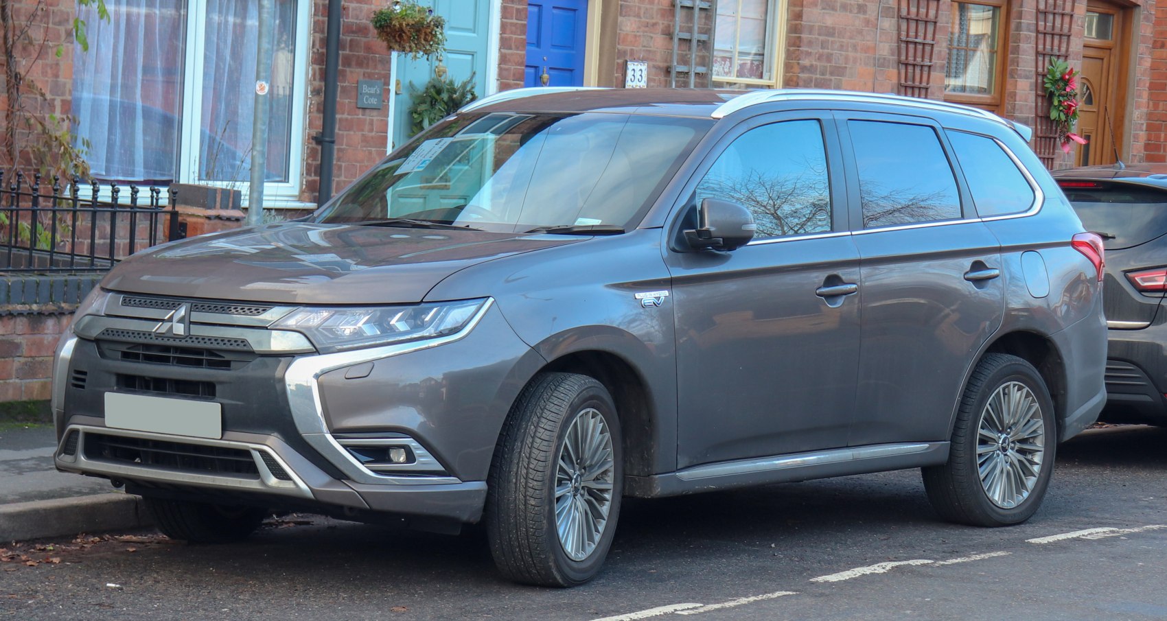 Front side view of SUV with LED headlights and alloy wheels