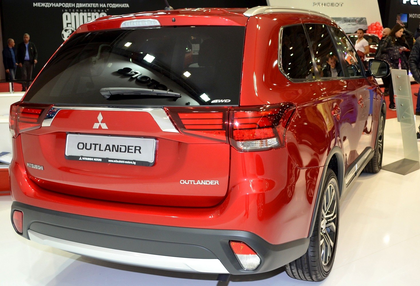 Rear view focusing on tail lights and rear design of polished red SUV