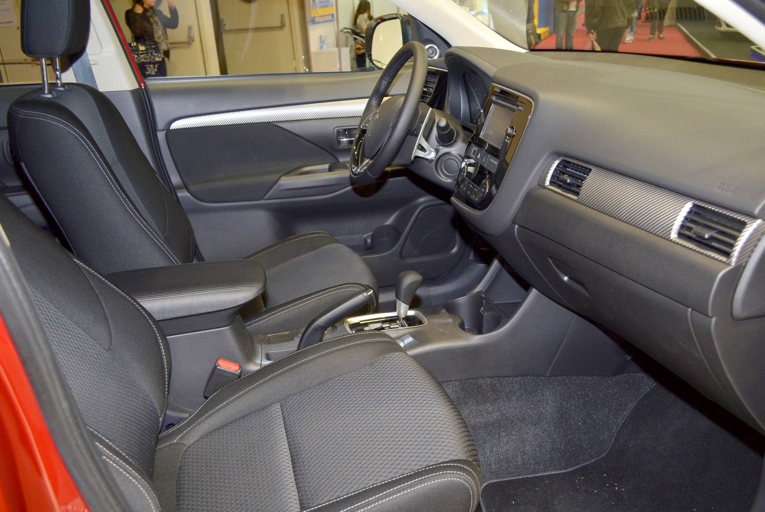 Modern car interior with dashboard, steering wheel, seats and center console
