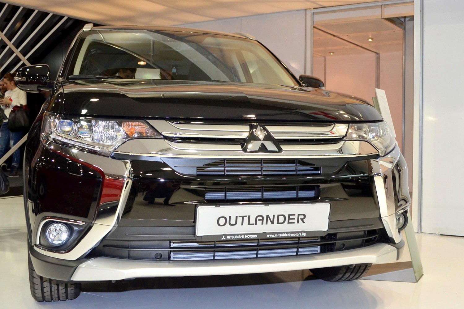 Close-up of front grille and headlights with chrome accents