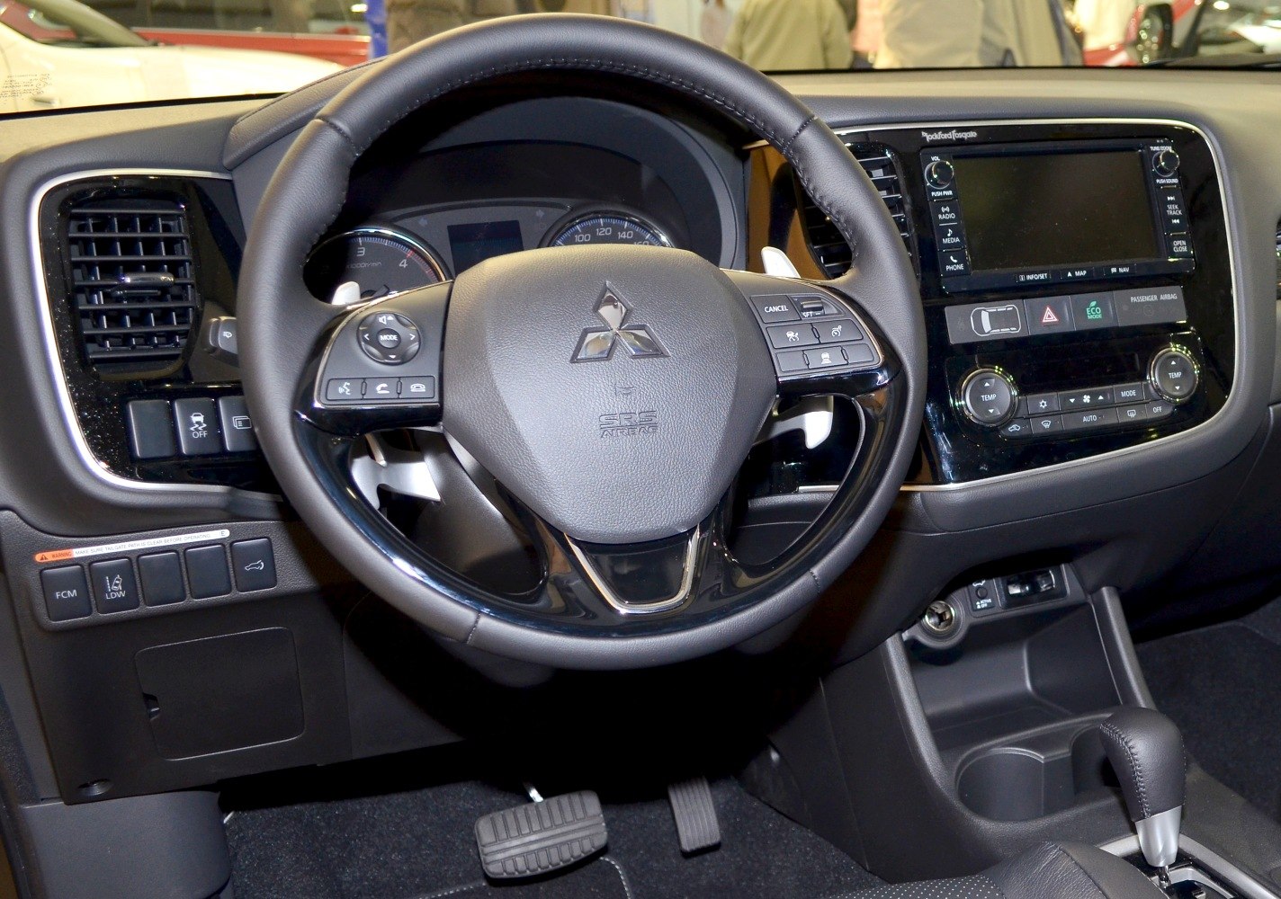 Steering wheel with controls and dashboard infotainment system