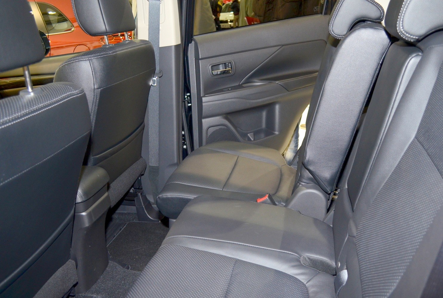 Rear interior seating with leather upholstery and door panel