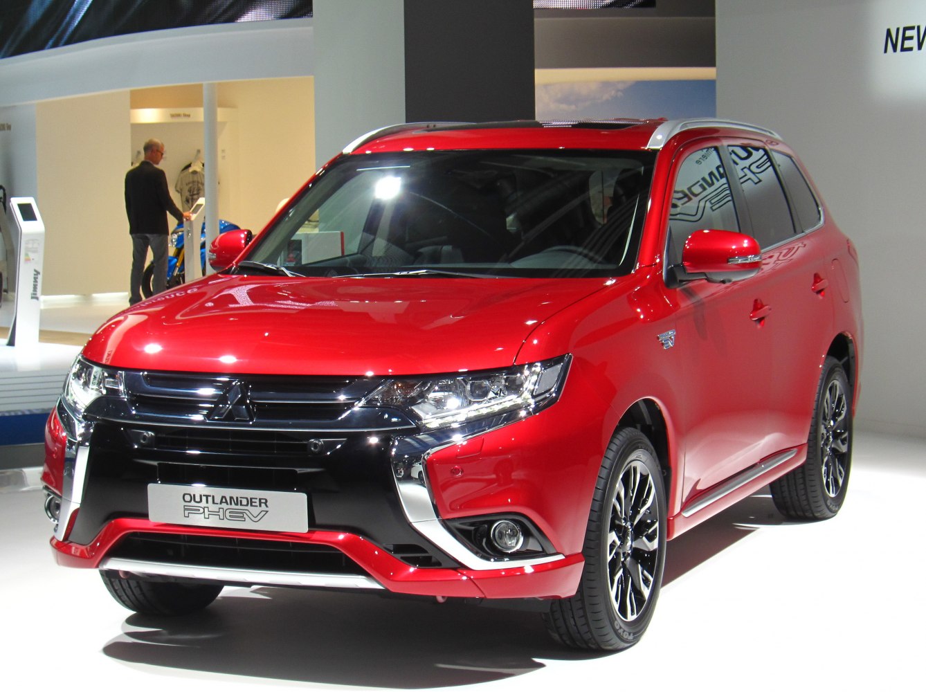 Front view of red SUV with sleek grille and modern headlights