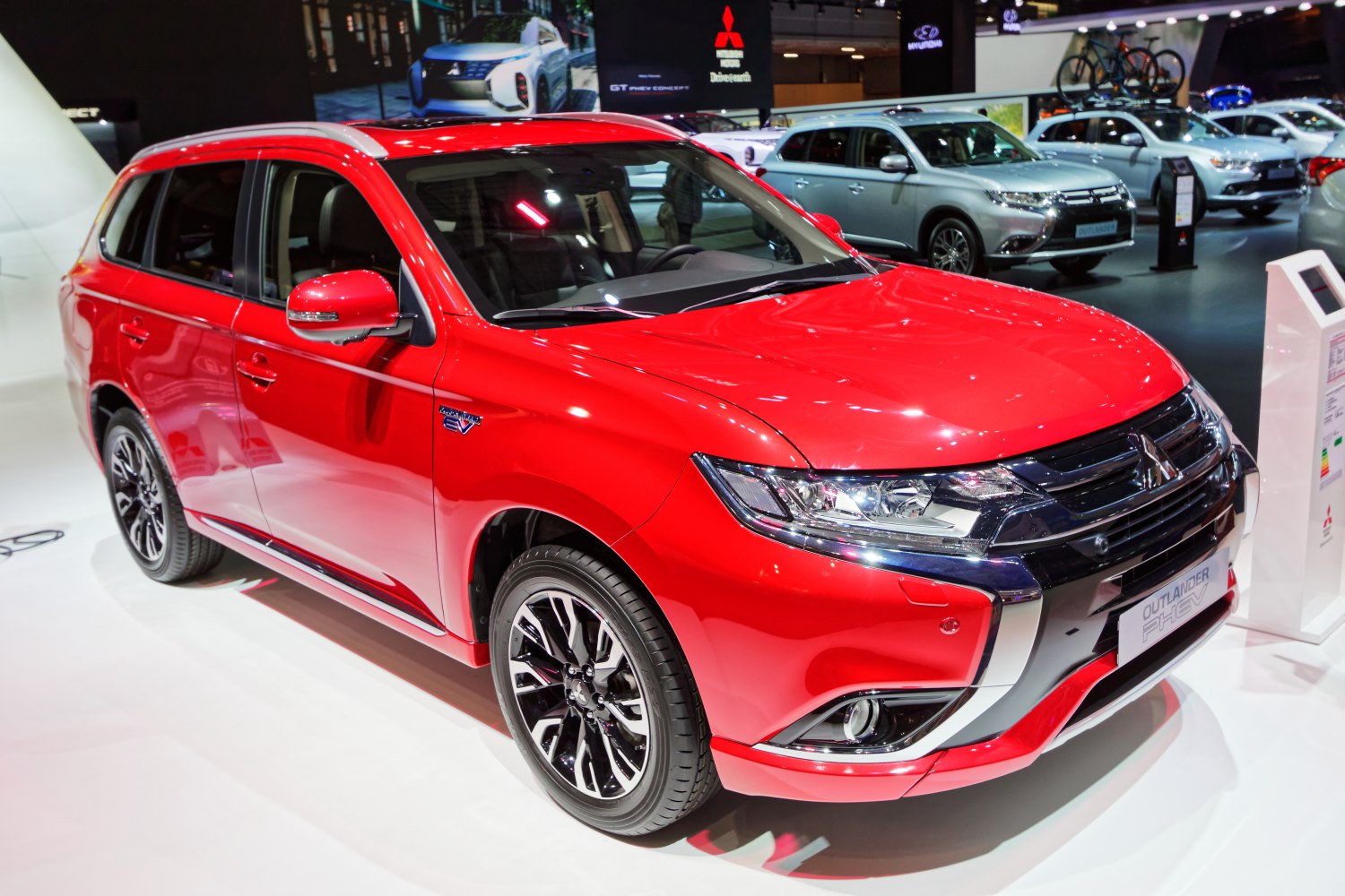 Red mid-size SUV with LED headlights and alloy wheels