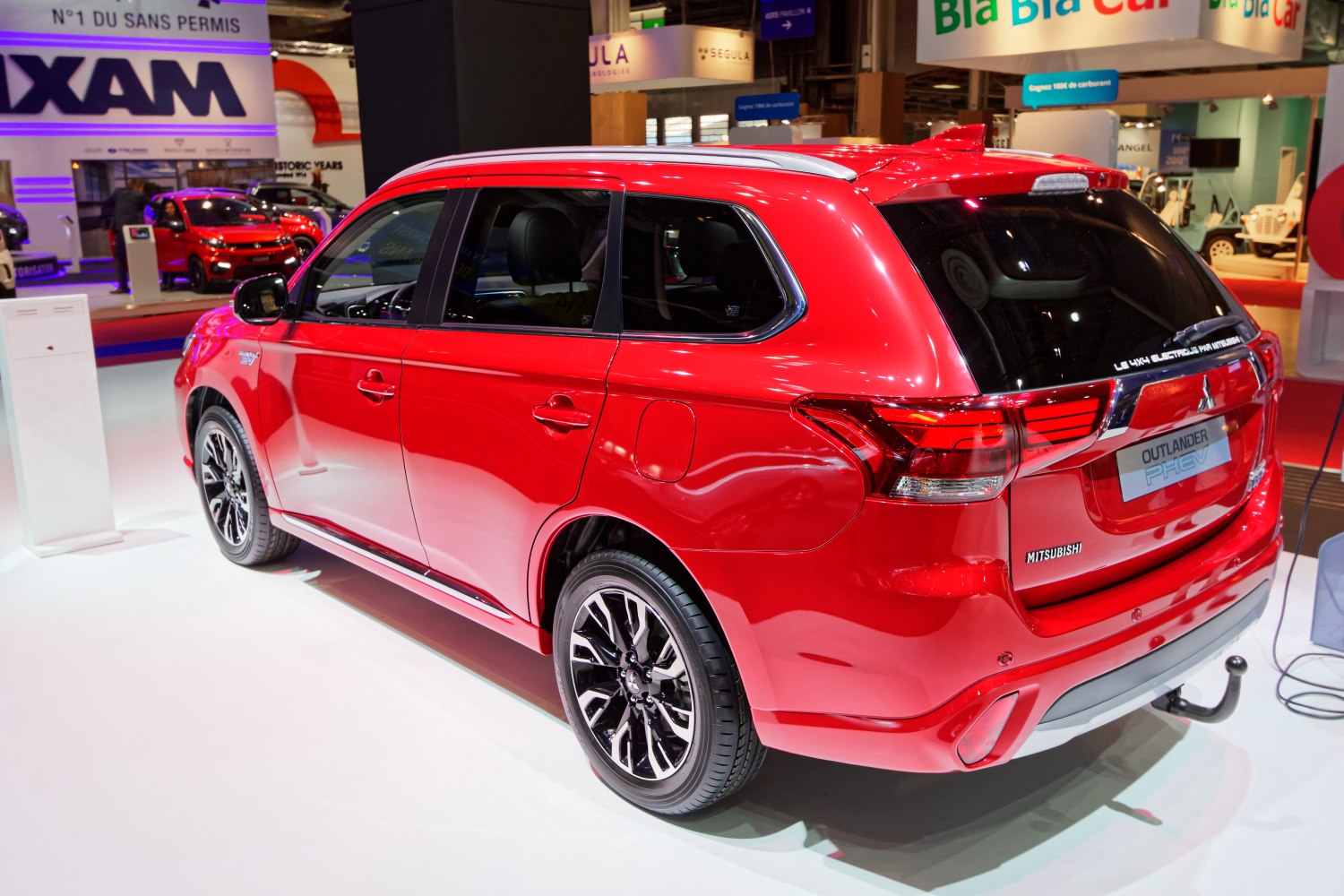 Red SUV rear side with alloy wheels and sleek design