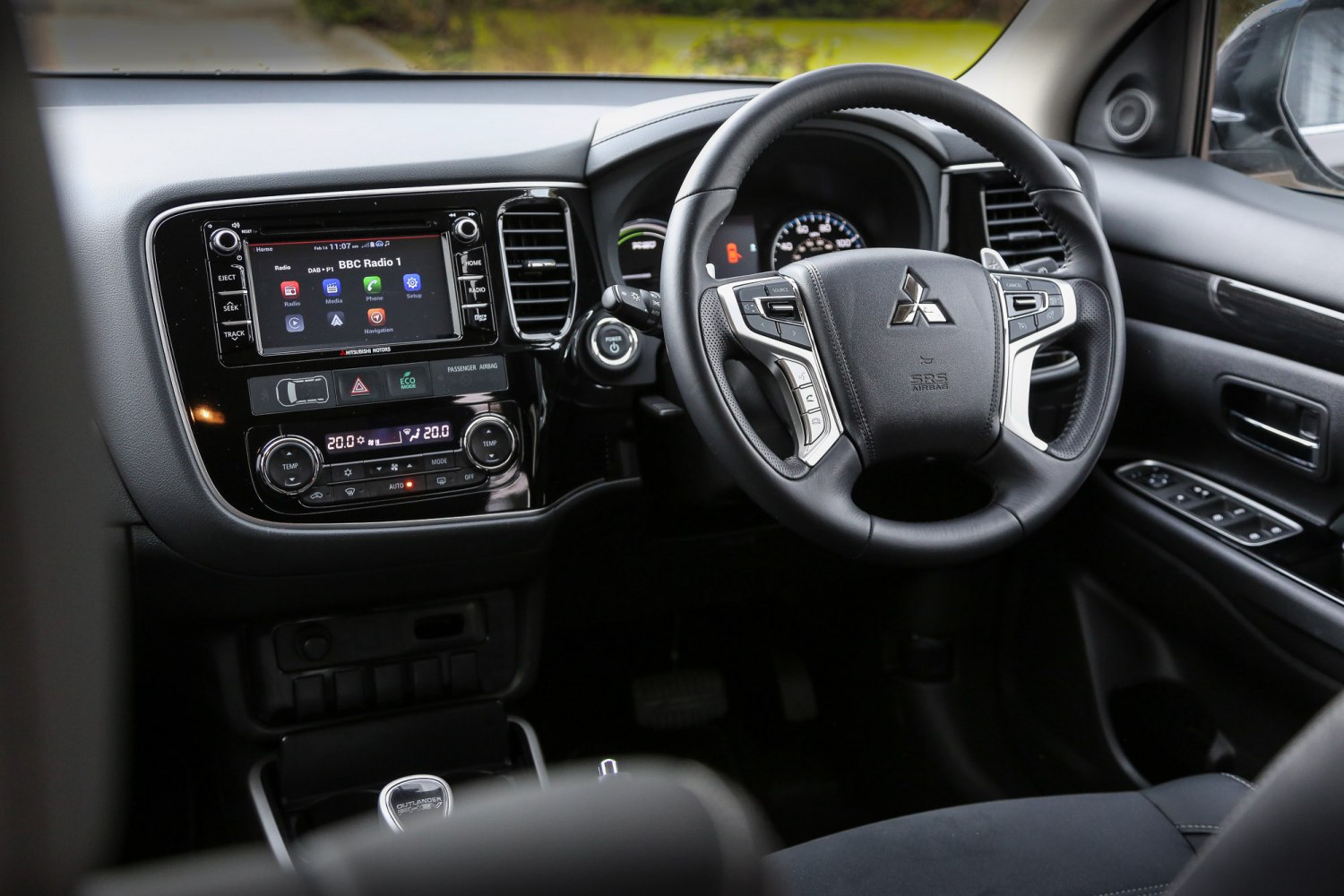 Interior dashboard with touchscreen and multi-function steering wheel