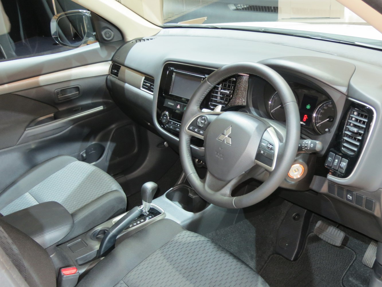 Interior dashboard and steering wheel with center console of a modern vehicle