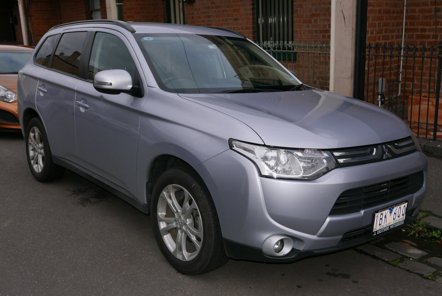 SUV front and side view highlighting headlights and alloy wheels