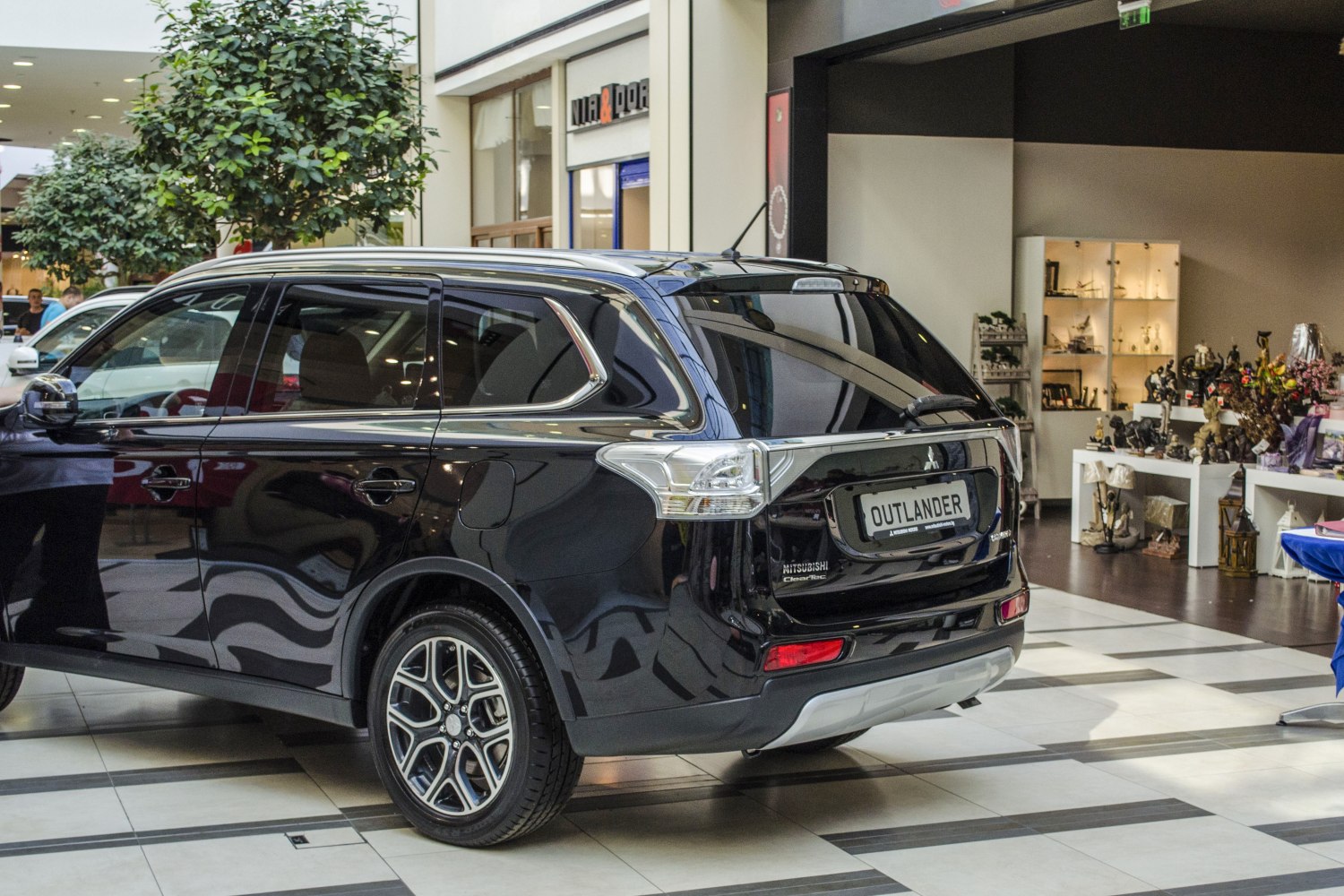 Rear and side view of an SUV with alloy wheels and tinted windows