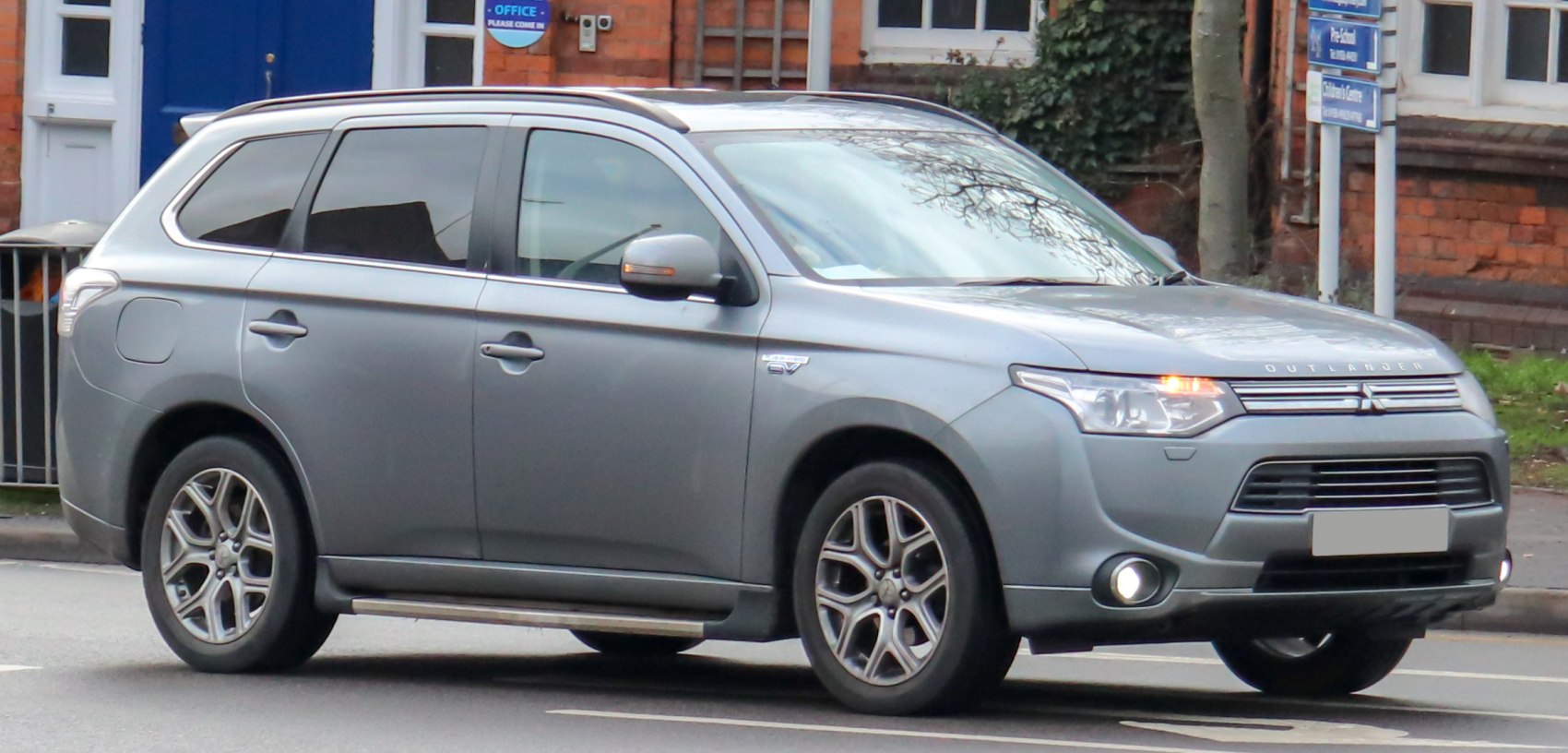 Side profile of mid-size SUV with daytime running lights