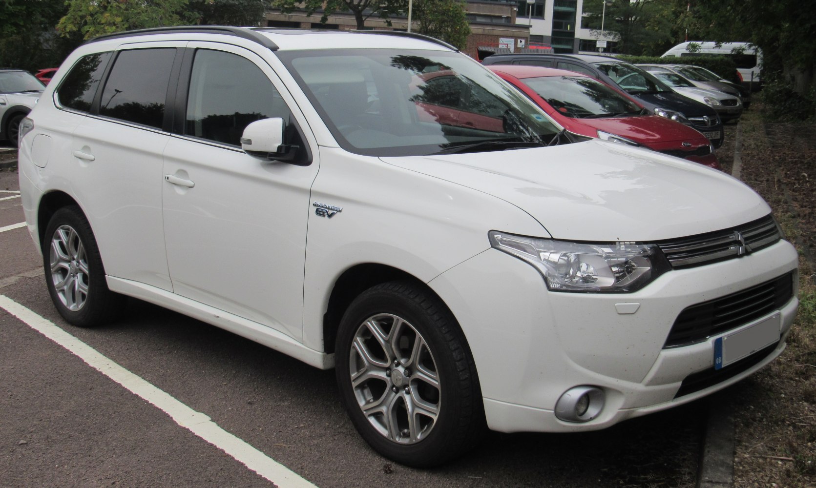 White SUV with plug-in hybrid EV badge, alloy wheels, front and side view