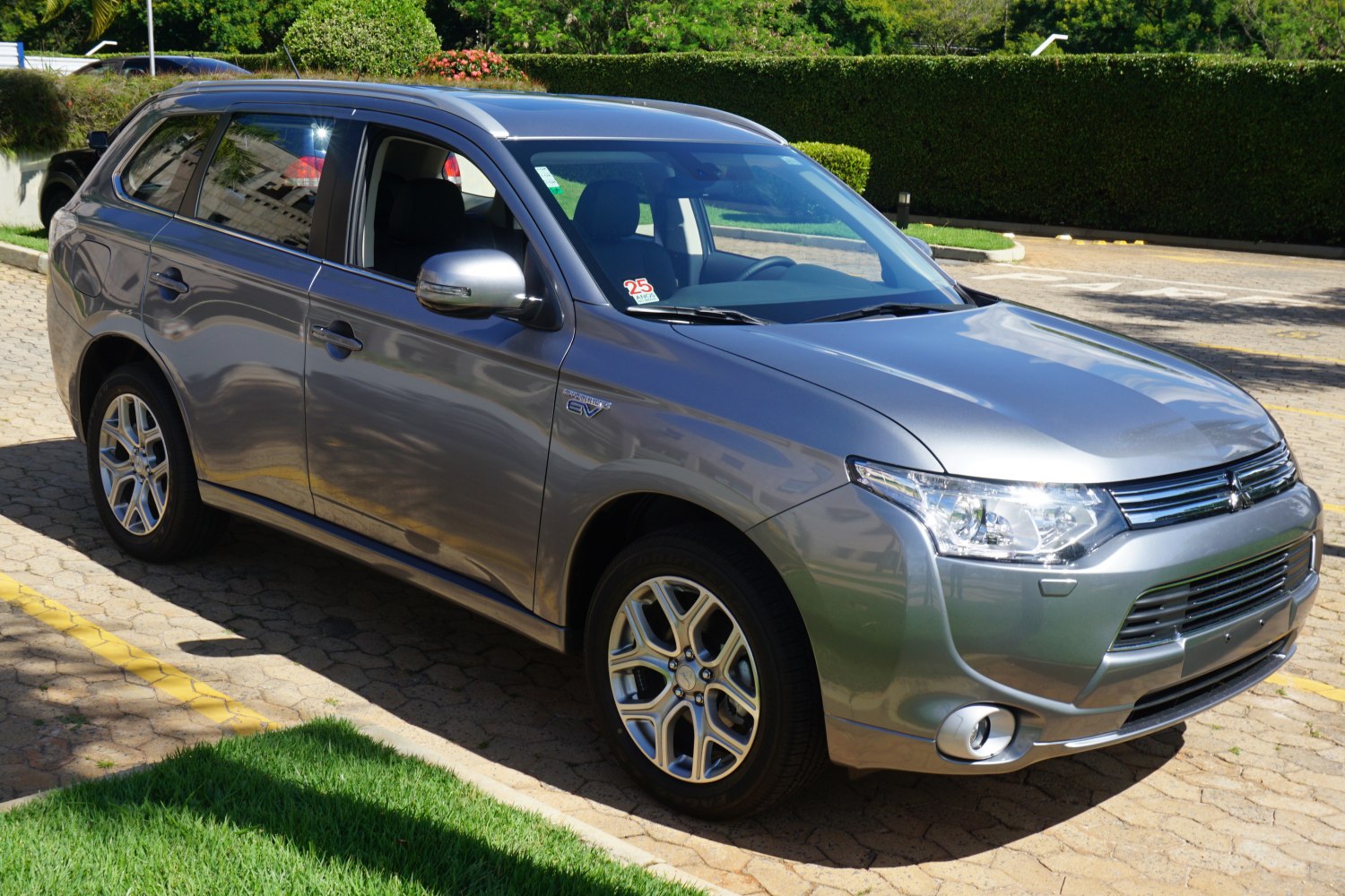 Silver SUV front side profile with alloy wheels and modern headlights