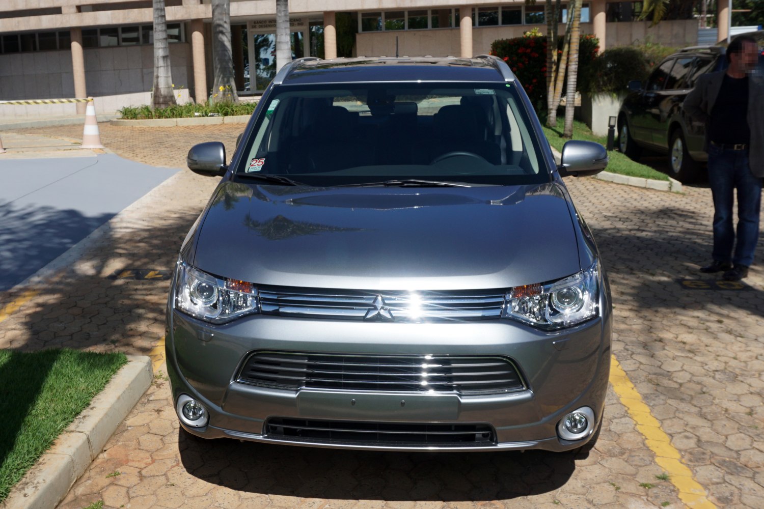 Front view with headlights, grille, and fog lights