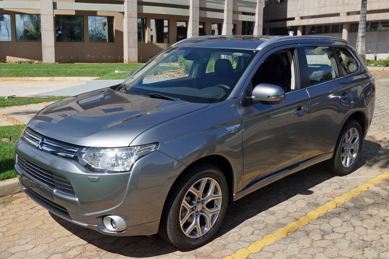 Silver SUV front and side exterior with alloy wheels in daylight
