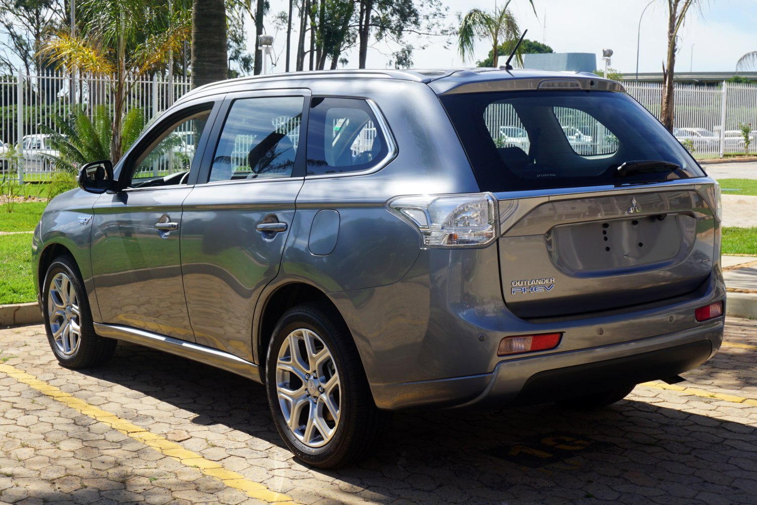 Rear side view of SUV with alloy wheels and clear tail lights.