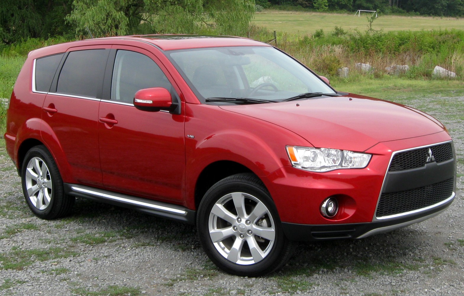 Red SUV with distinctive front grille and alloy wheels