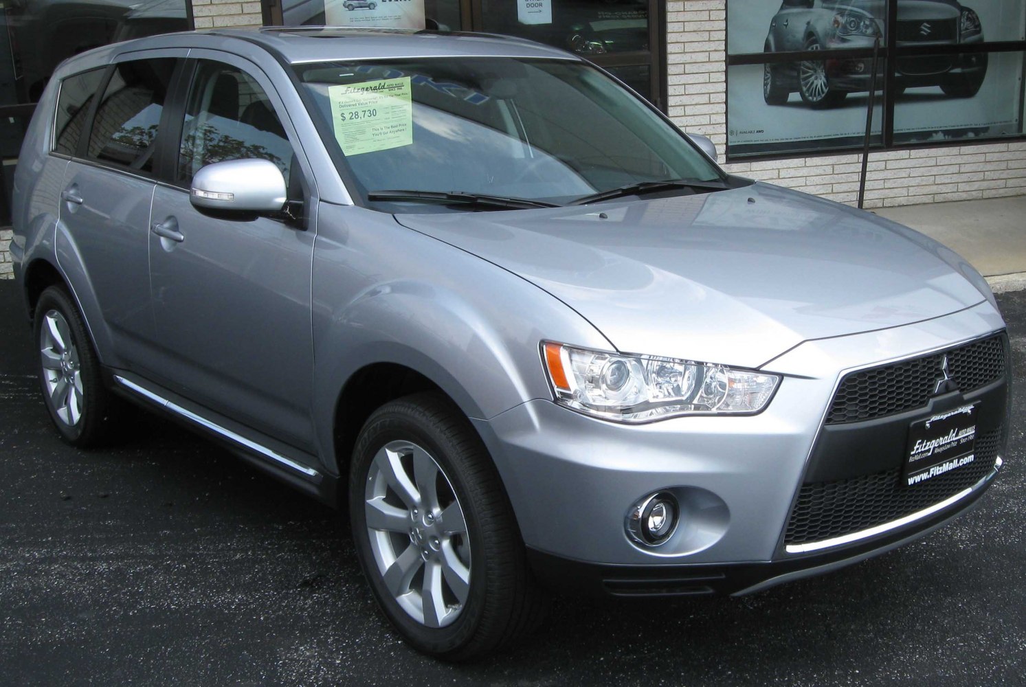 Silver modern SUV front and side view with distinct grille and headlights