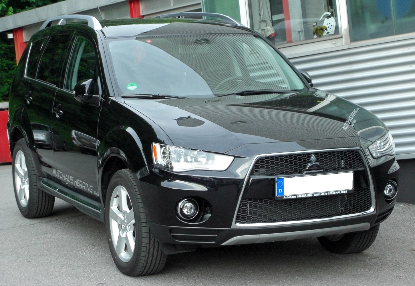Front view of SUV with distinctive grille and headlights
