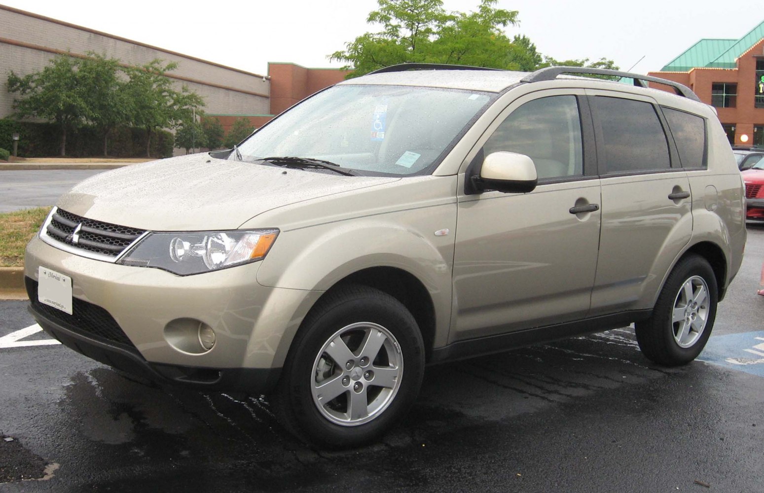Silver SUV front side view with roof rails and alloy wheels