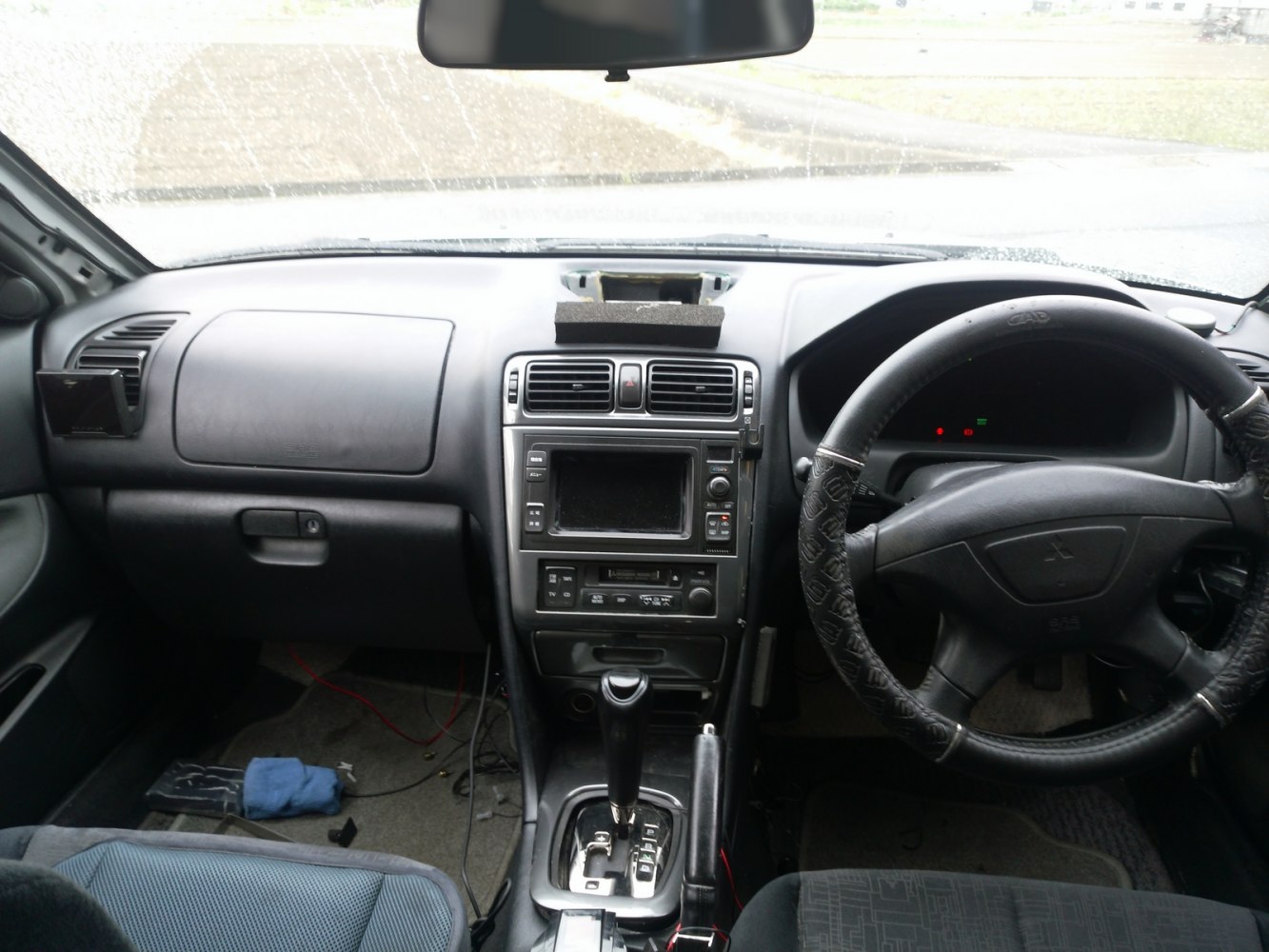 Dashboard, steering wheel, and center console with gear shift