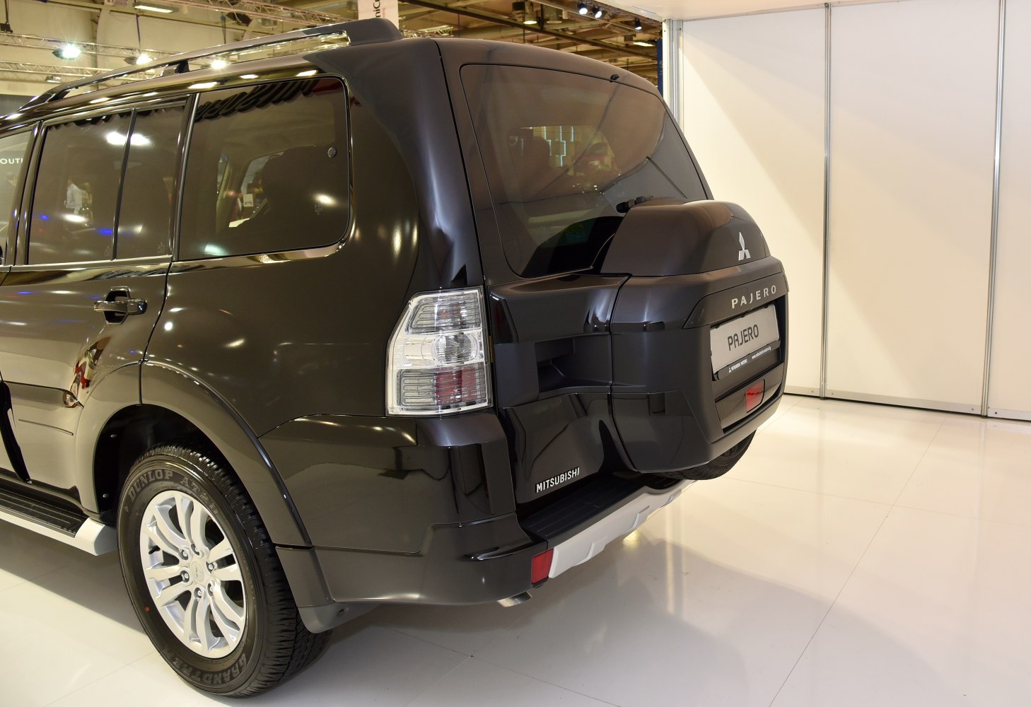Rear view with spare wheel cover and tinted windows