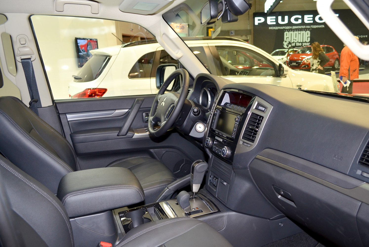 Interior dashboard and controls with steering wheel and seats