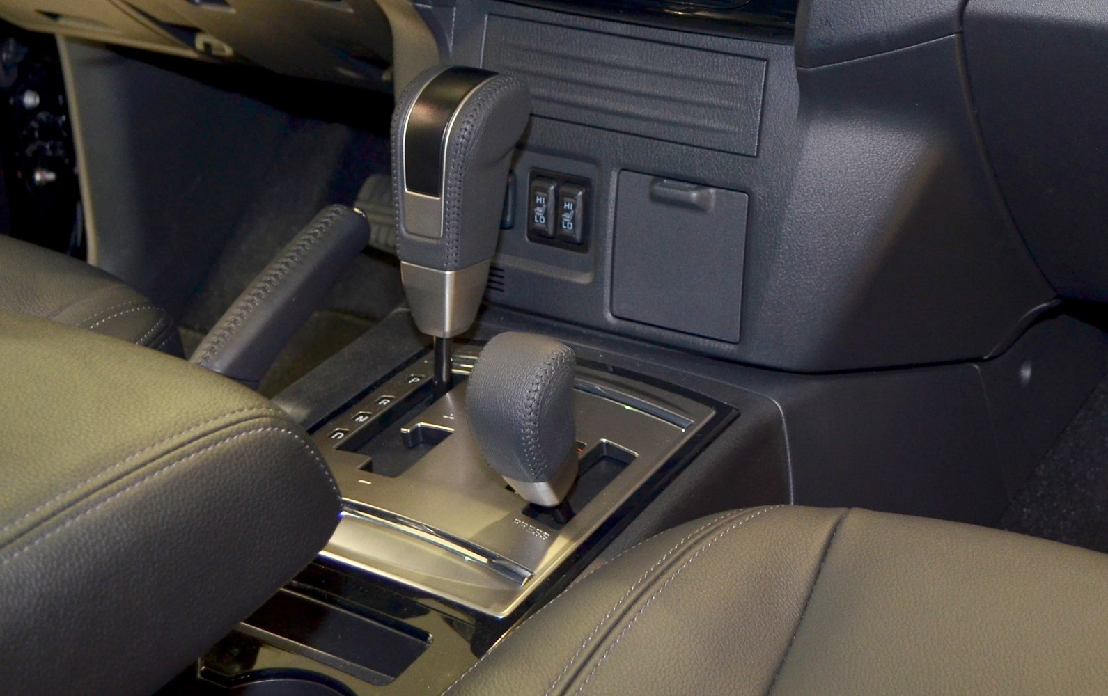 Gear shift and handbrake in car center console
