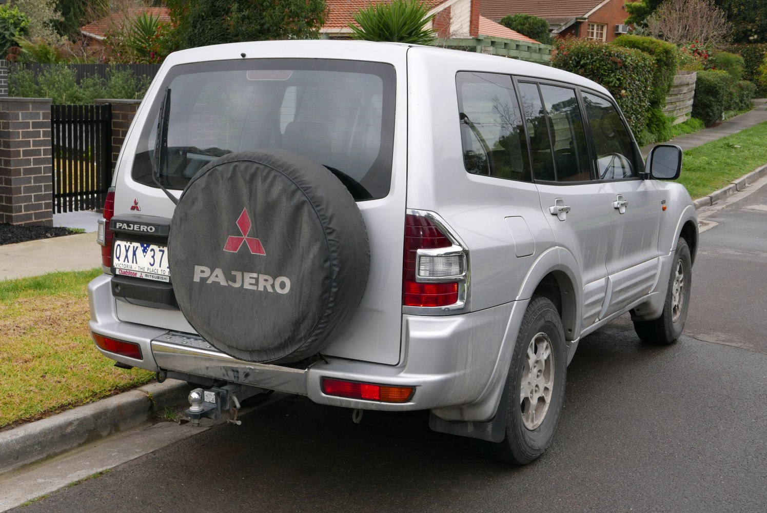 Rear SUV view with spare tire cover and tow hitch