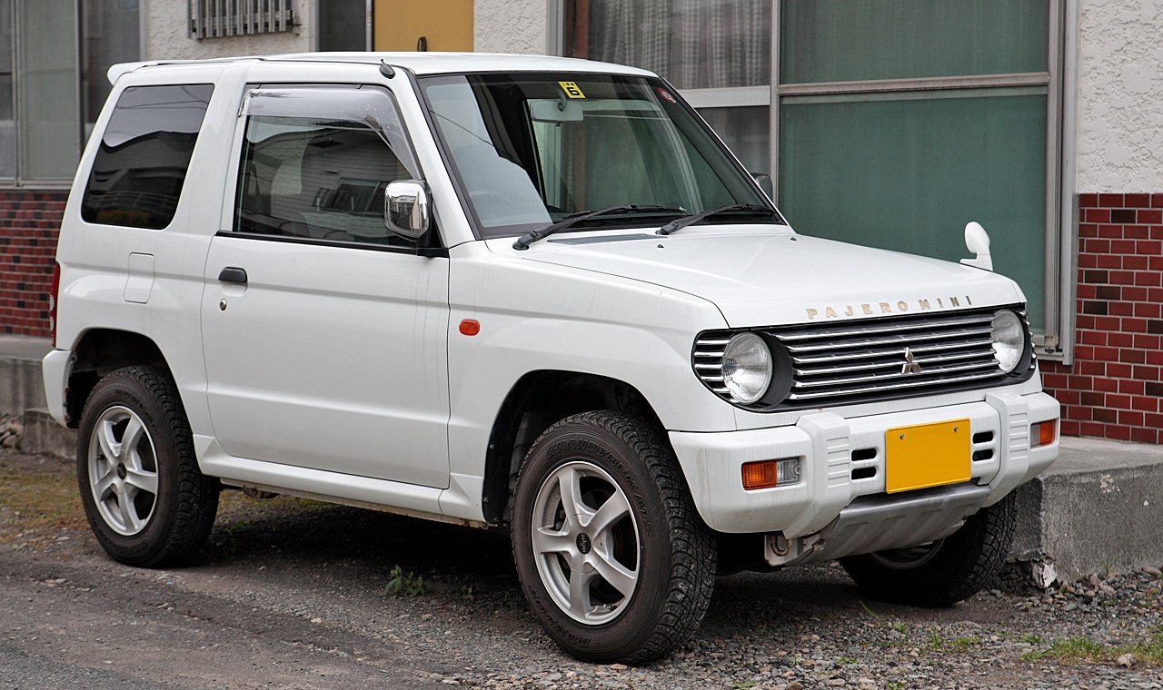 Compact SUV with round headlights and front grille.