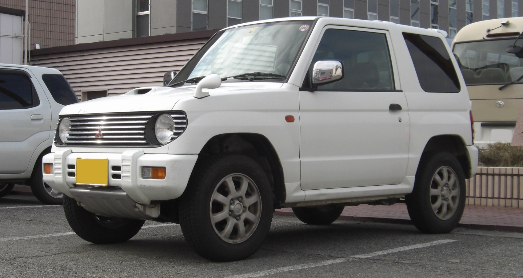 Front and side view of compact off-road SUV with rugged features