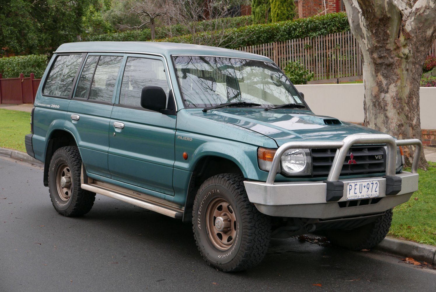 Front-side view of SUV with V6 engine and bull bar