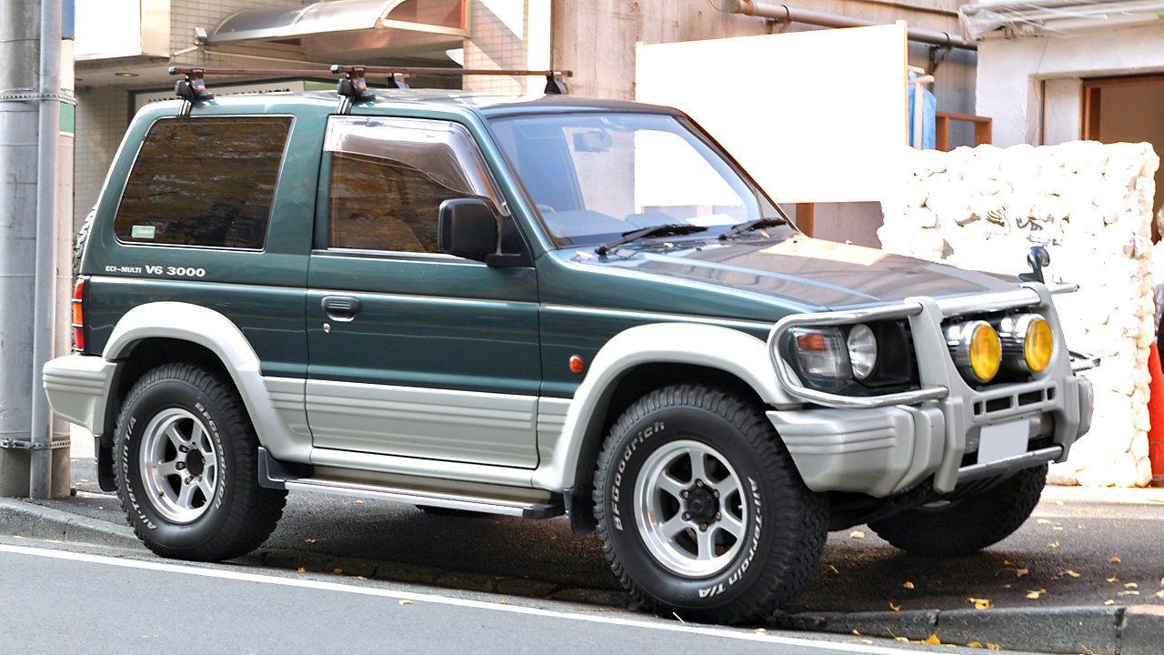 Vintage SUV with front protection bars and roof rack
