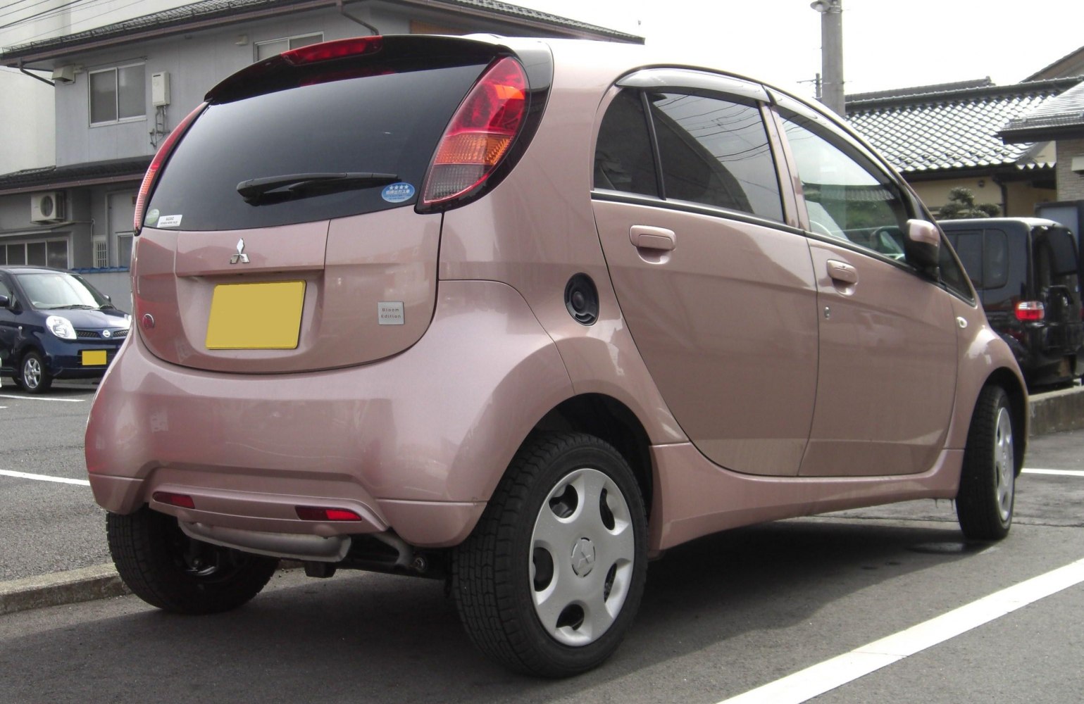 Rear view of compact hatchback with distinct taillights and tinted windows